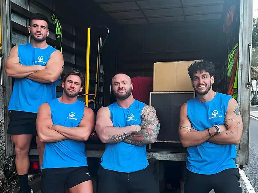 The Fit Removals crew in front of a loaded truck